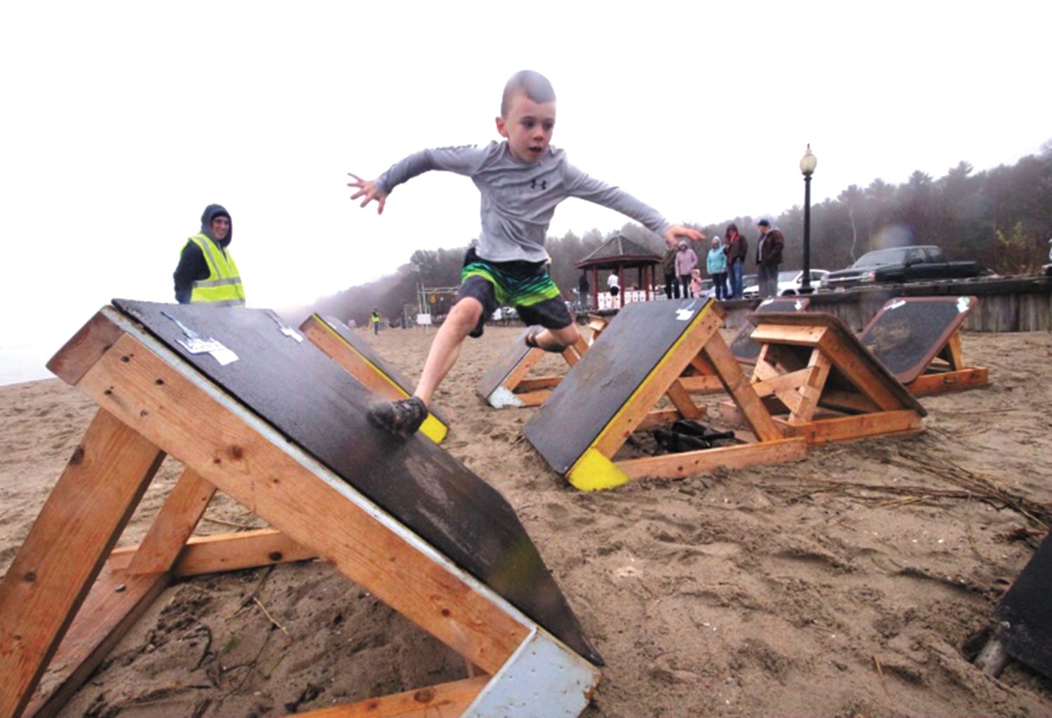 LEADING UP TO A DIP: Eight-year-old Warwick resident Luke McGowan traverses the Bounding Clam obstacle at the 2022 Frozen Clam Dip Obstaplunge. Luke gets a lot of practice at his dad’s gym Laid-back Fitness. He says the Obstaplunge is the best one around because, “it lasts longer and is a way more fun experience.” (Submitted photo)